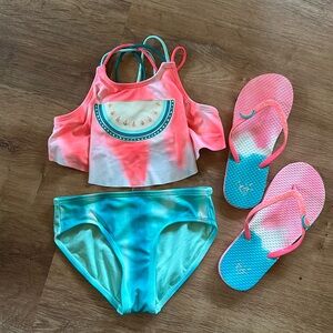 Watermelon color changing bathing suit and flip flops. Size 10.